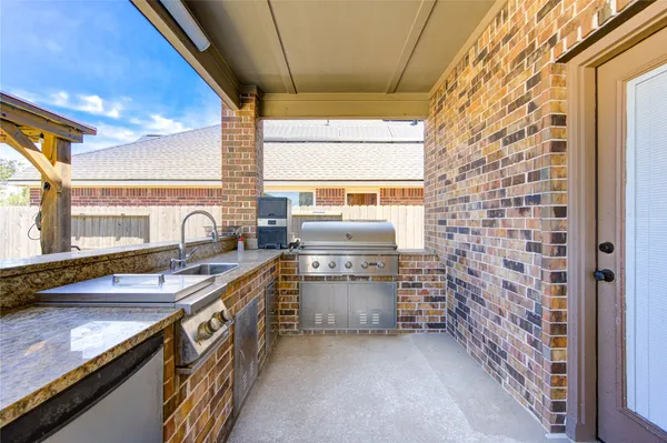 a view of a livingroom with workspace and a window