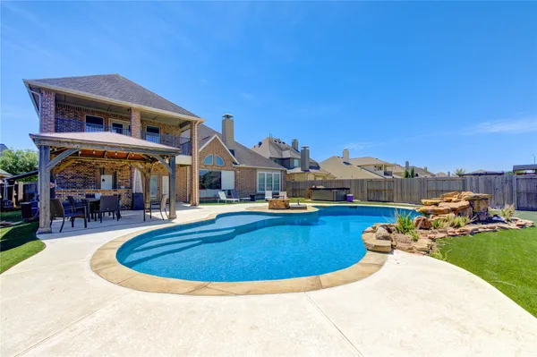 a view of a swimming pool with a patio