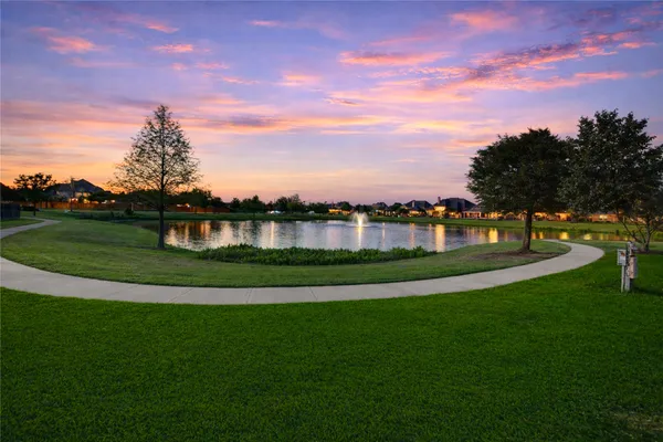 a view of a lake with a big yard