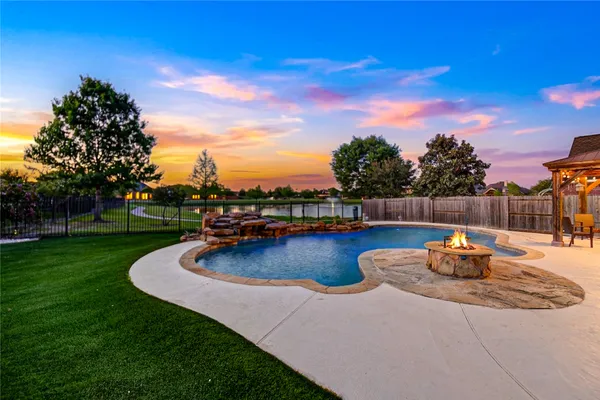 a view of a swimming pool with a patio