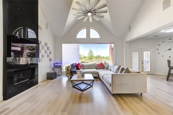 a living room with furniture and a large window