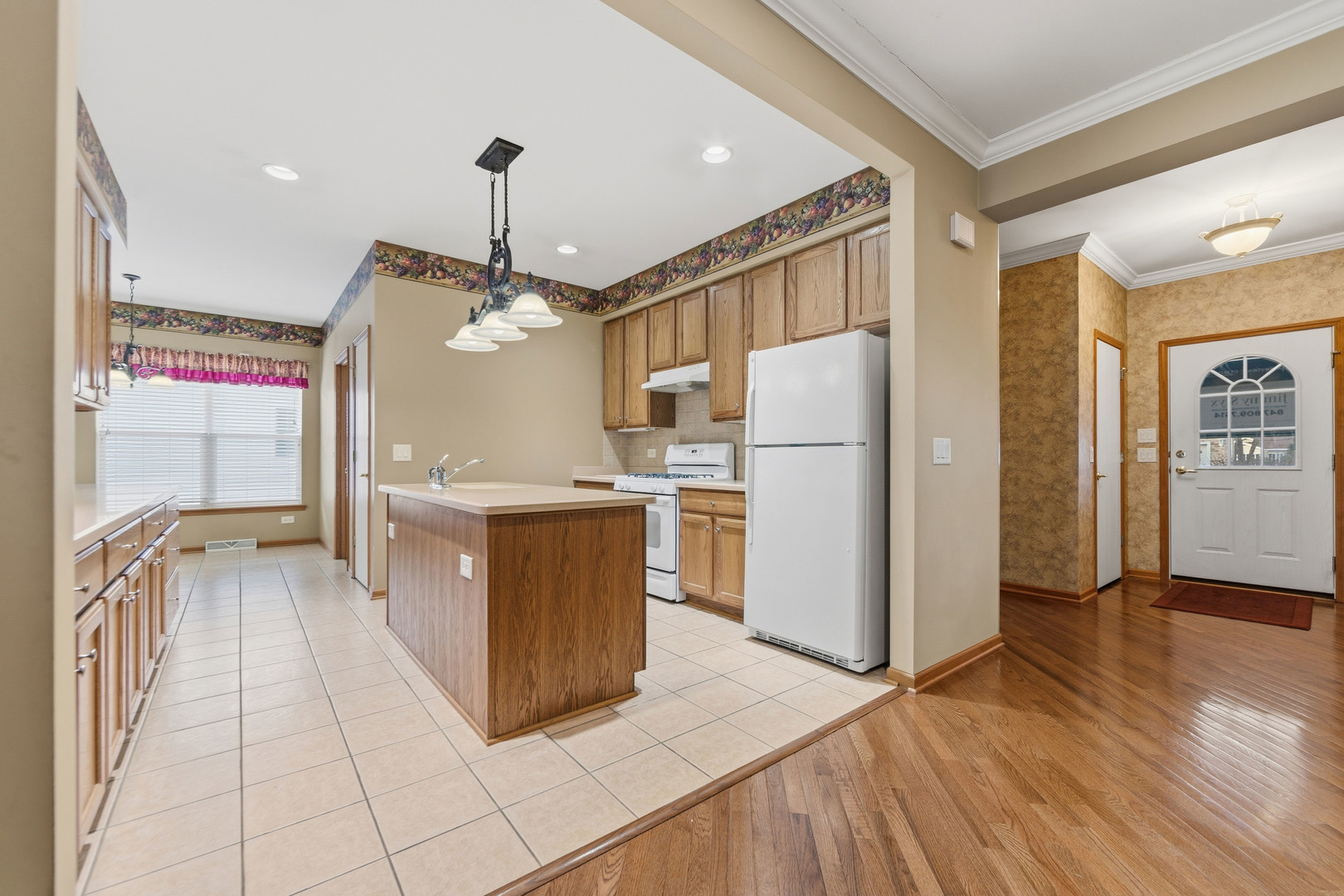 102 Hitching Post Lane Grayslake, IL 60030 - Photo 29 of 38 a kitchen with stainless steel appliances granite countertop a refrigerator a sink and a stove