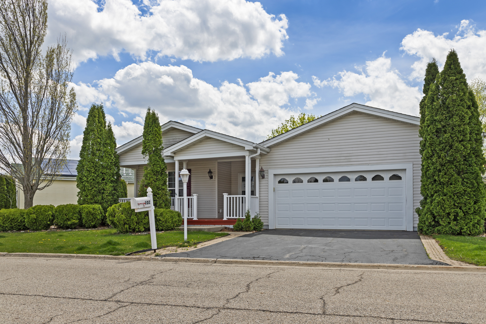102 Hitching Post Lane Grayslake, IL 60030 - Photo 37 of 38 a view of a house with a yard and plants