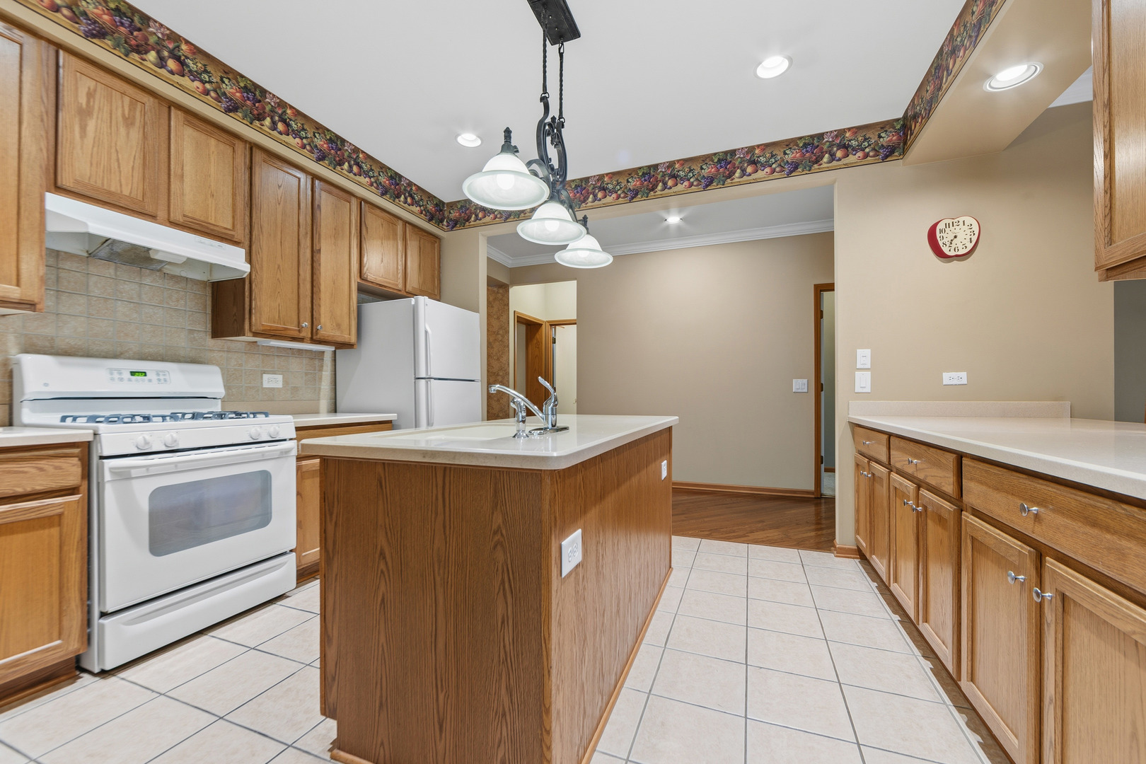 102 Hitching Post Lane Grayslake, IL 60030 - Photo 6 of 38 a kitchen with a sink and a stove top oven