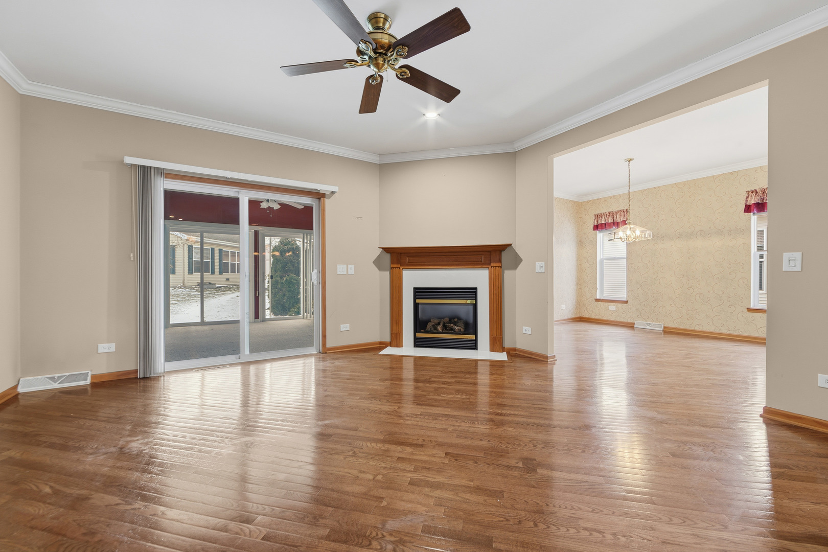 102 Hitching Post Lane Grayslake, IL 60030 - Photo 8 of 38 a view of an empty room with window and wooden floor