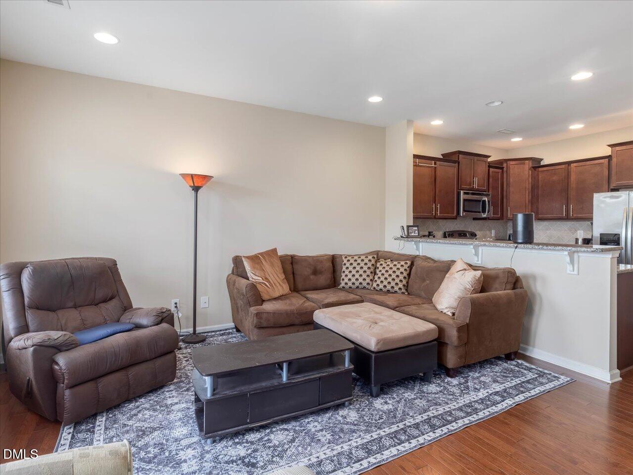 409 Provincial Street Raleigh, NC 27603 - Photo 14 of 44 a living room with furniture and a wooden floor