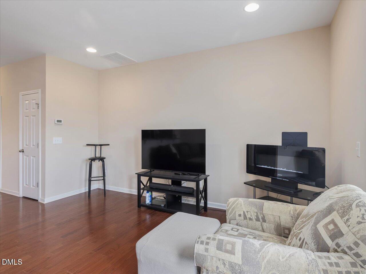 409 Provincial Street Raleigh, NC 27603 - Photo 15 of 44 a living room with furniture and a flat screen tv