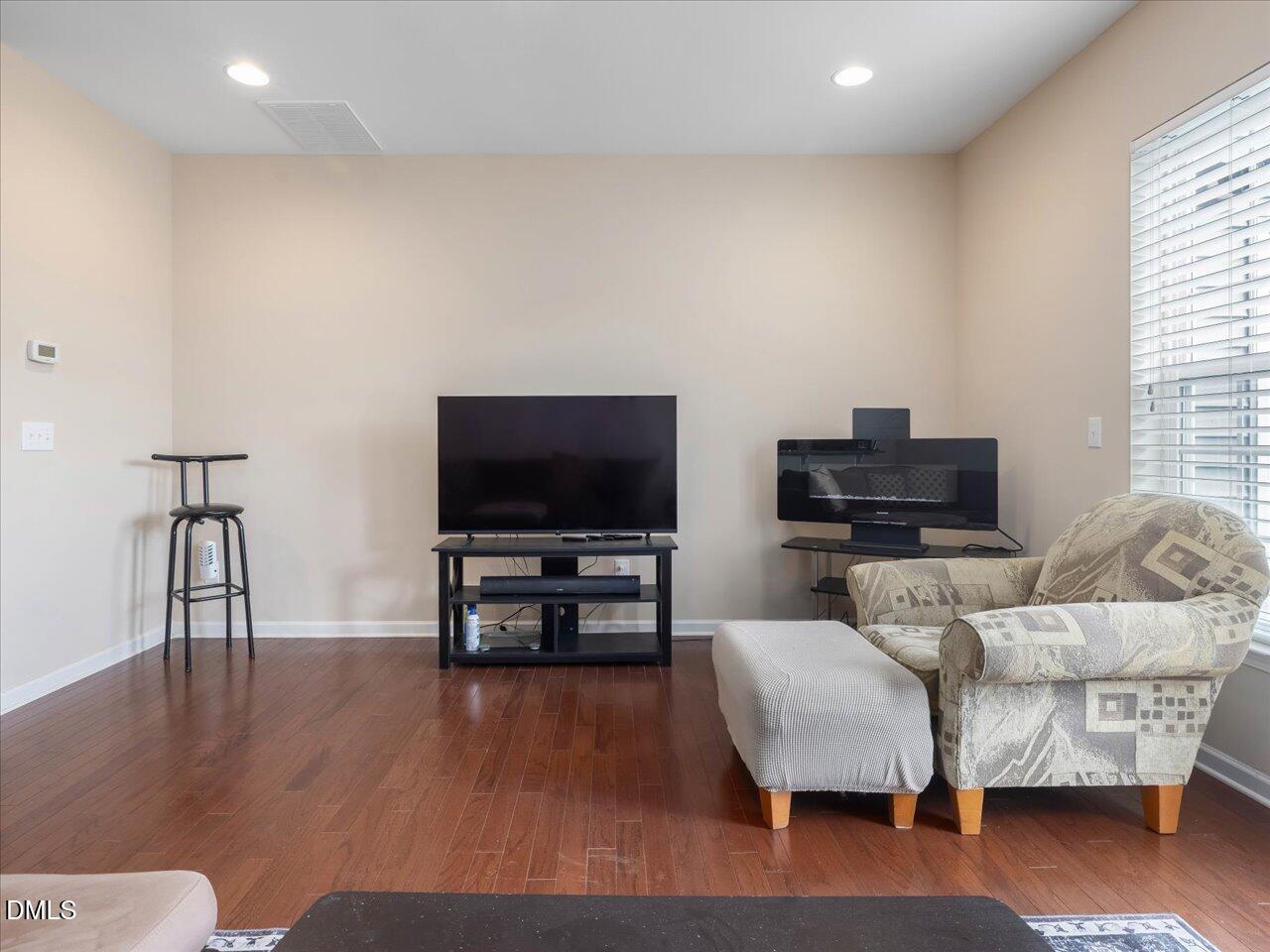 409 Provincial Street Raleigh, NC 27603 - Photo 16 of 44 a living room with furniture and a flat screen tv