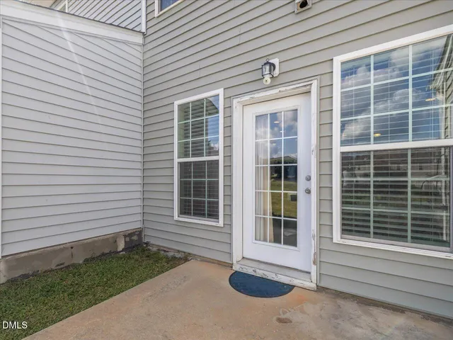 front view of a room that has a door and a window
