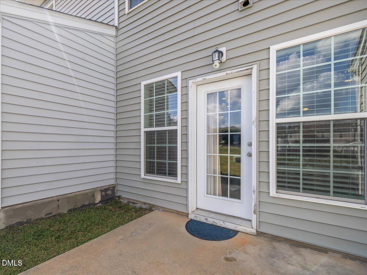 409 Provincial Street Raleigh, NC 27603 - Photo 20 of 44 a front view of a house with a yard
