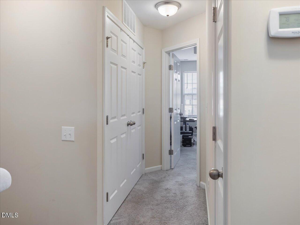 409 Provincial Street Raleigh, NC 27603 - Photo 24 of 44 a view of a bathroom from a hallway