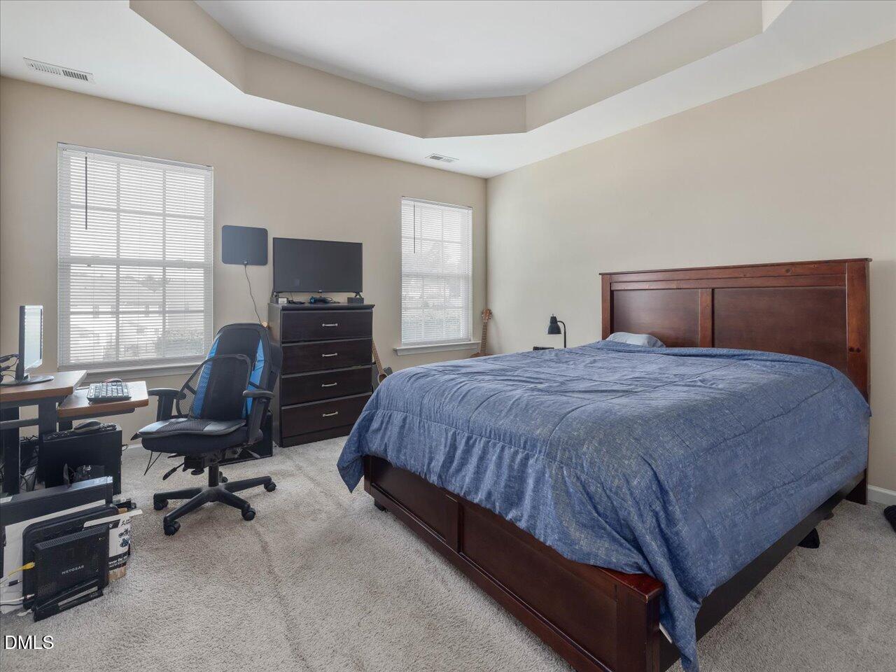 409 Provincial Street Raleigh, NC 27603 - Photo 25 of 44 a bedroom with a bed a chair and computer on the desk
