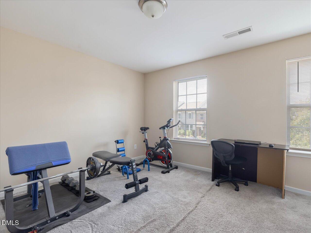 409 Provincial Street Raleigh, NC 27603 - Photo 28 of 44 a view of a workspace with furniture and a window