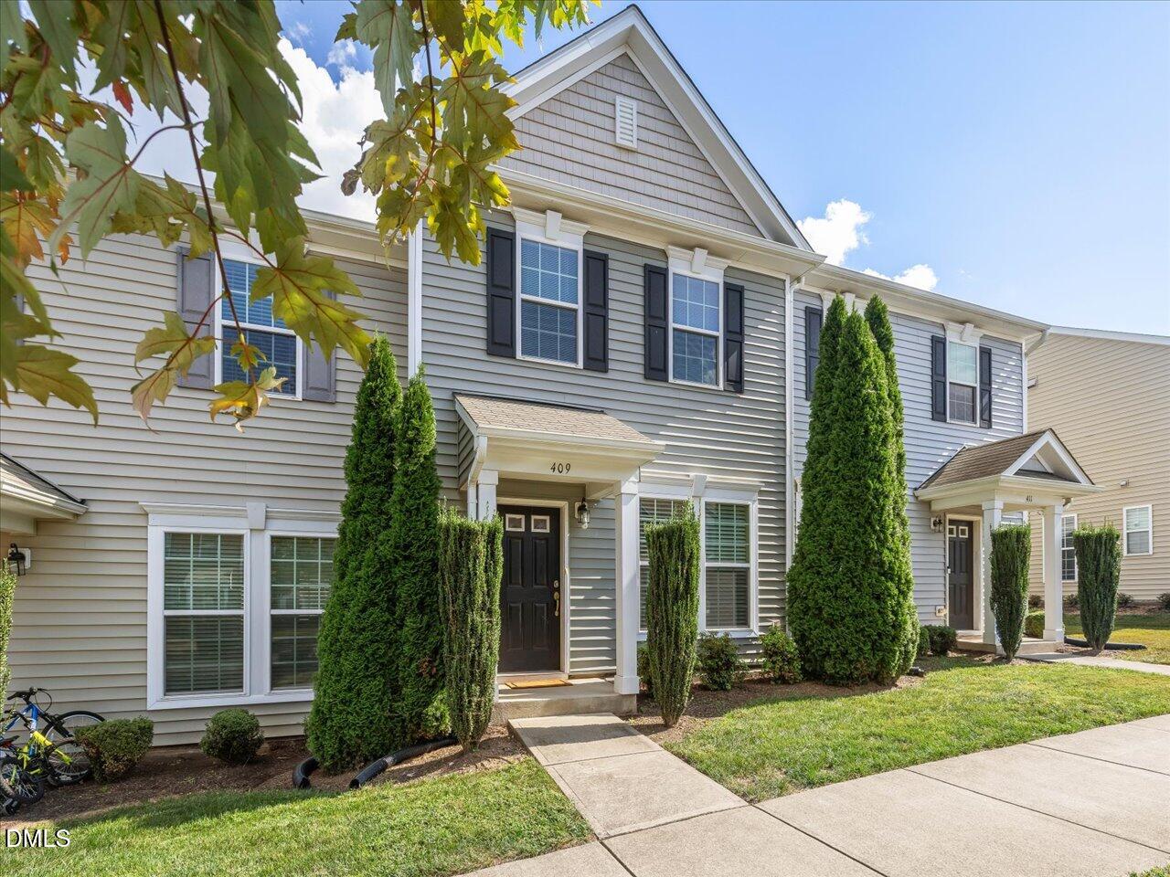409 Provincial Street Raleigh, NC 27603 - Photo 2 of 44 a front view of a house with a yard
