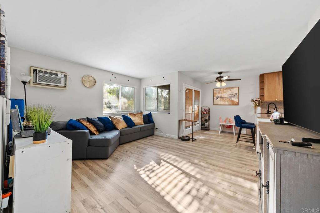 1280 West Main Street, Unit 42 El Cajon, CA 92020 - Photo 2 of 43 a living room with furniture and a flat screen tv