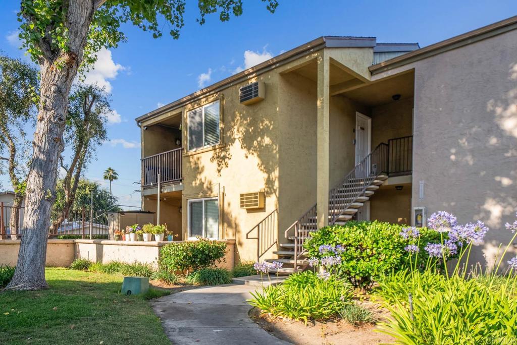 1280 West Main Street, Unit 42 El Cajon, CA 92020 - Photo 30 of 43 a front view of a house with garden