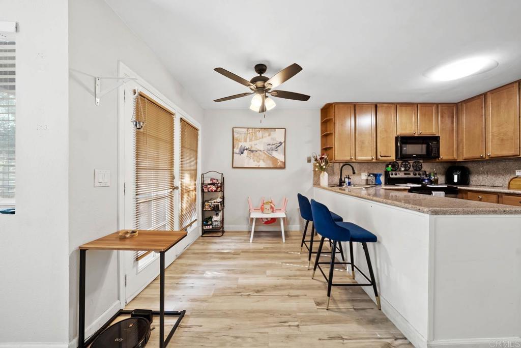 1280 West Main Street, Unit 42 El Cajon, CA 92020 - Photo 6 of 43 a view of a dining room with furniture window and wooden floor