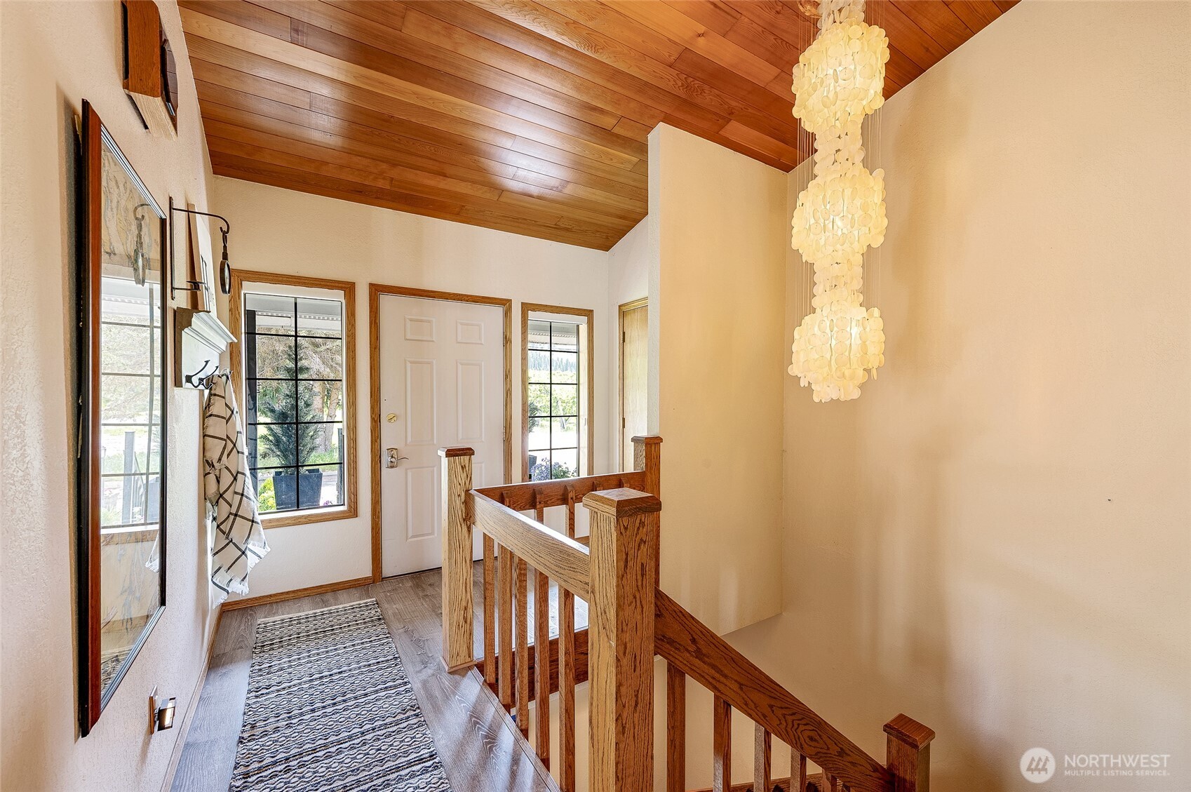9656 North Road Peshastin, WA 98847 - Photo 8 of 40 a view of a hallway with wooden floor and staircase