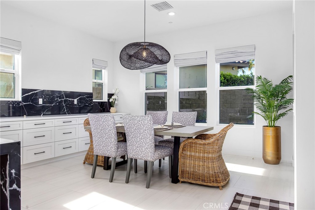80440 Old Ranch Trail South La Quinta, CA 92253 - Photo 11 of 46 a view of a dining room with furniture and window