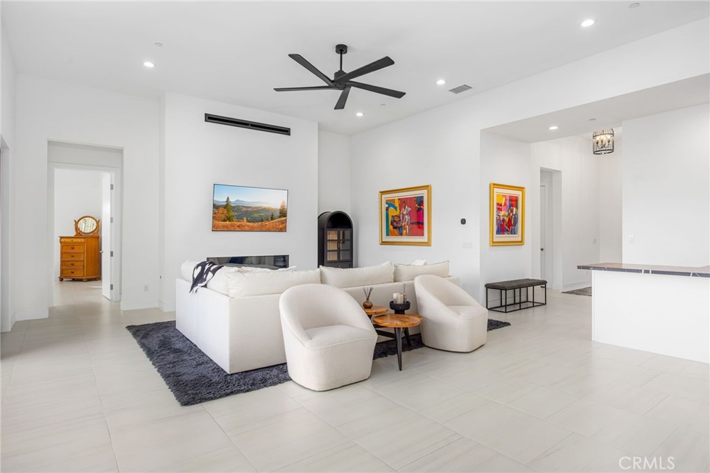 80440 Old Ranch Trail South La Quinta, CA 92253 - Photo 12 of 46 a living room with furniture and white walls