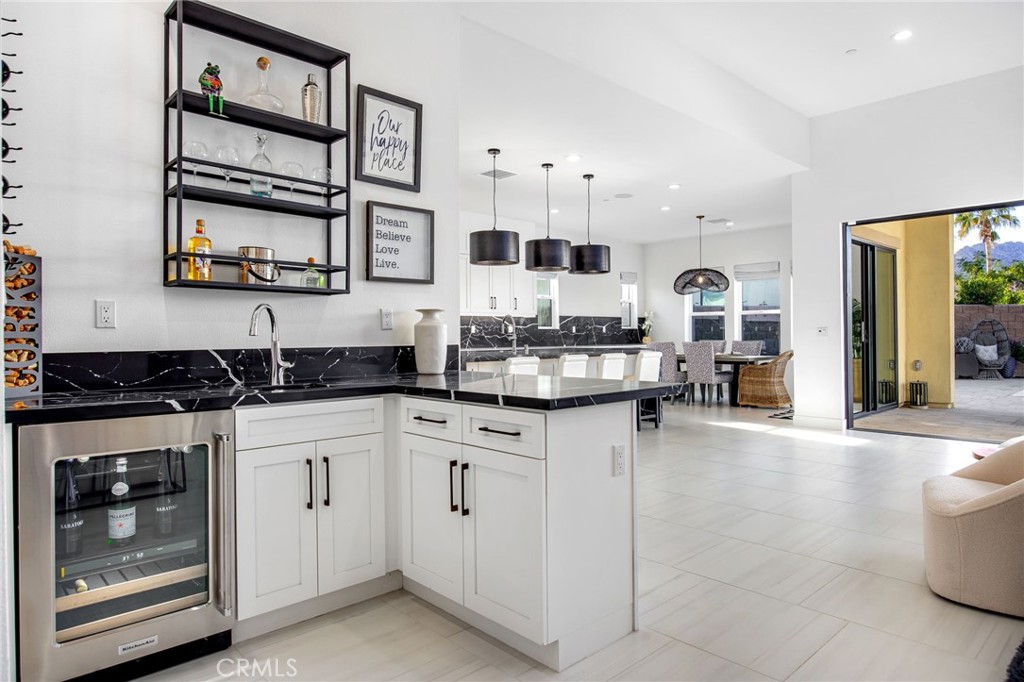 80440 Old Ranch Trail South La Quinta, CA 92253 - Photo 13 of 46 a kitchen with stainless steel appliances granite countertop a stove and cabinets