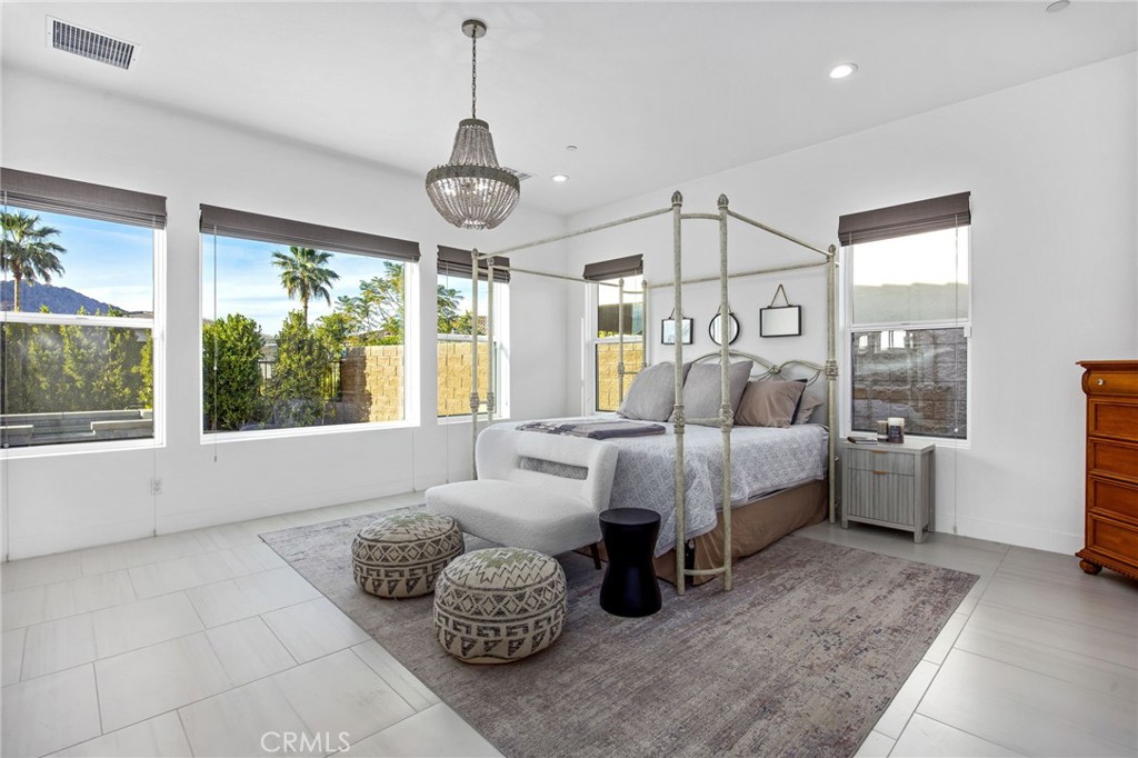 80440 Old Ranch Trail South La Quinta, CA 92253 - Photo 16 of 46 a bed room with furniture and a large window