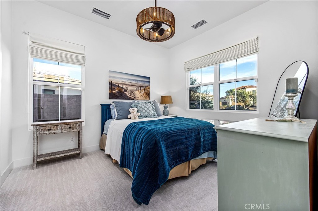 80440 Old Ranch Trail South La Quinta, CA 92253 - Photo 24 of 46 a bedroom with a bed and a large window