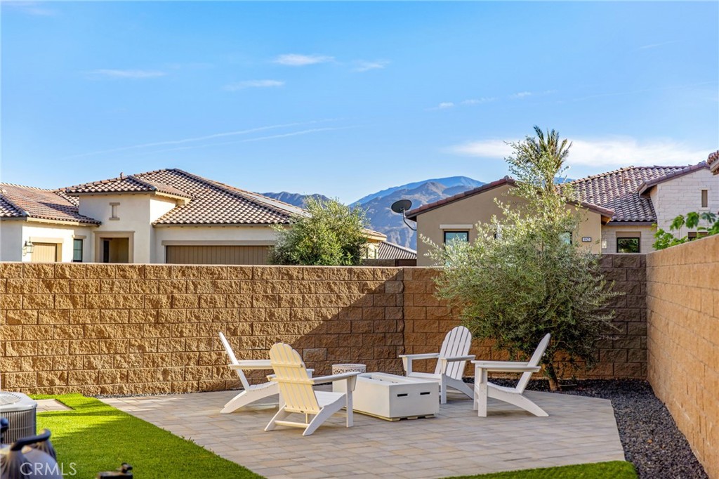 80440 Old Ranch Trail South La Quinta, CA 92253 - Photo 29 of 46 a view of a patio with table and chairs and potted plants