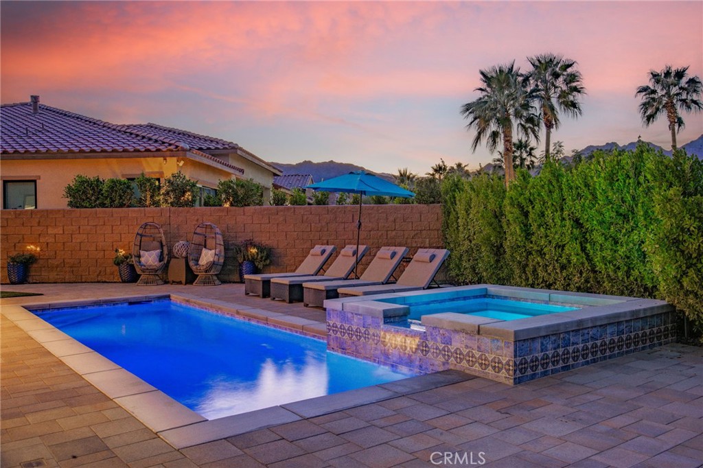 80440 Old Ranch Trail South La Quinta, CA 92253 - Photo 3 of 46 a view of a swimming pool with outdoor seating and plants