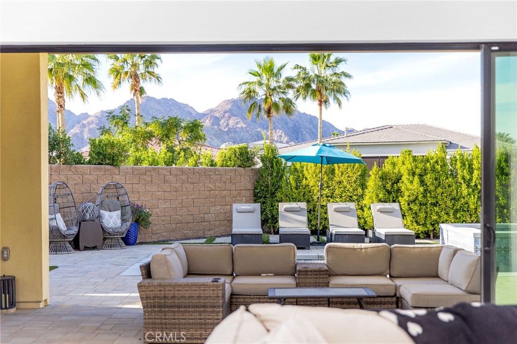 80440 Old Ranch Trail South La Quinta, CA 92253 - Photo 35 of 46 a living room with furniture and a large window