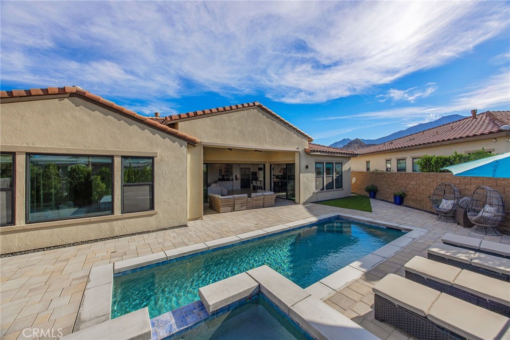 80440 Old Ranch Trail South La Quinta, CA 92253 - Photo 39 of 46 a front view of house with yard outdoor seating and barbeque oven
