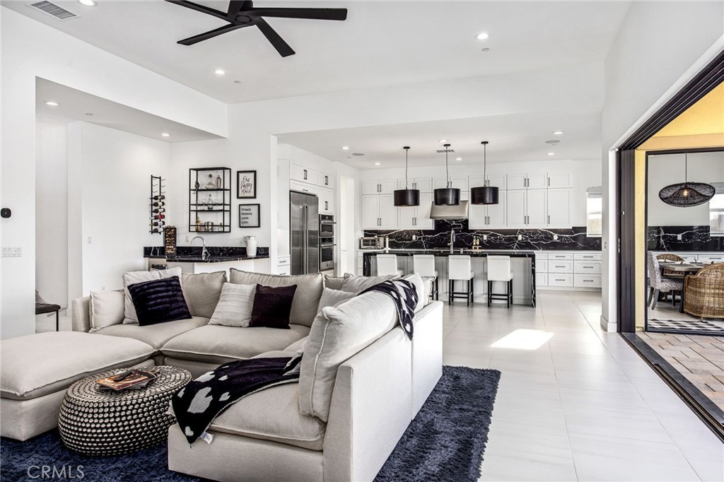80440 Old Ranch Trail South La Quinta, CA 92253 - Photo 7 of 46 a living room with furniture and kitchen view