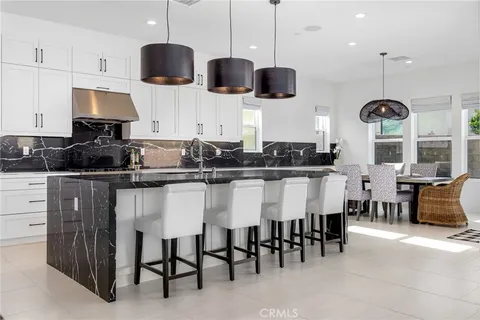 a bedroom with a large window and a bed