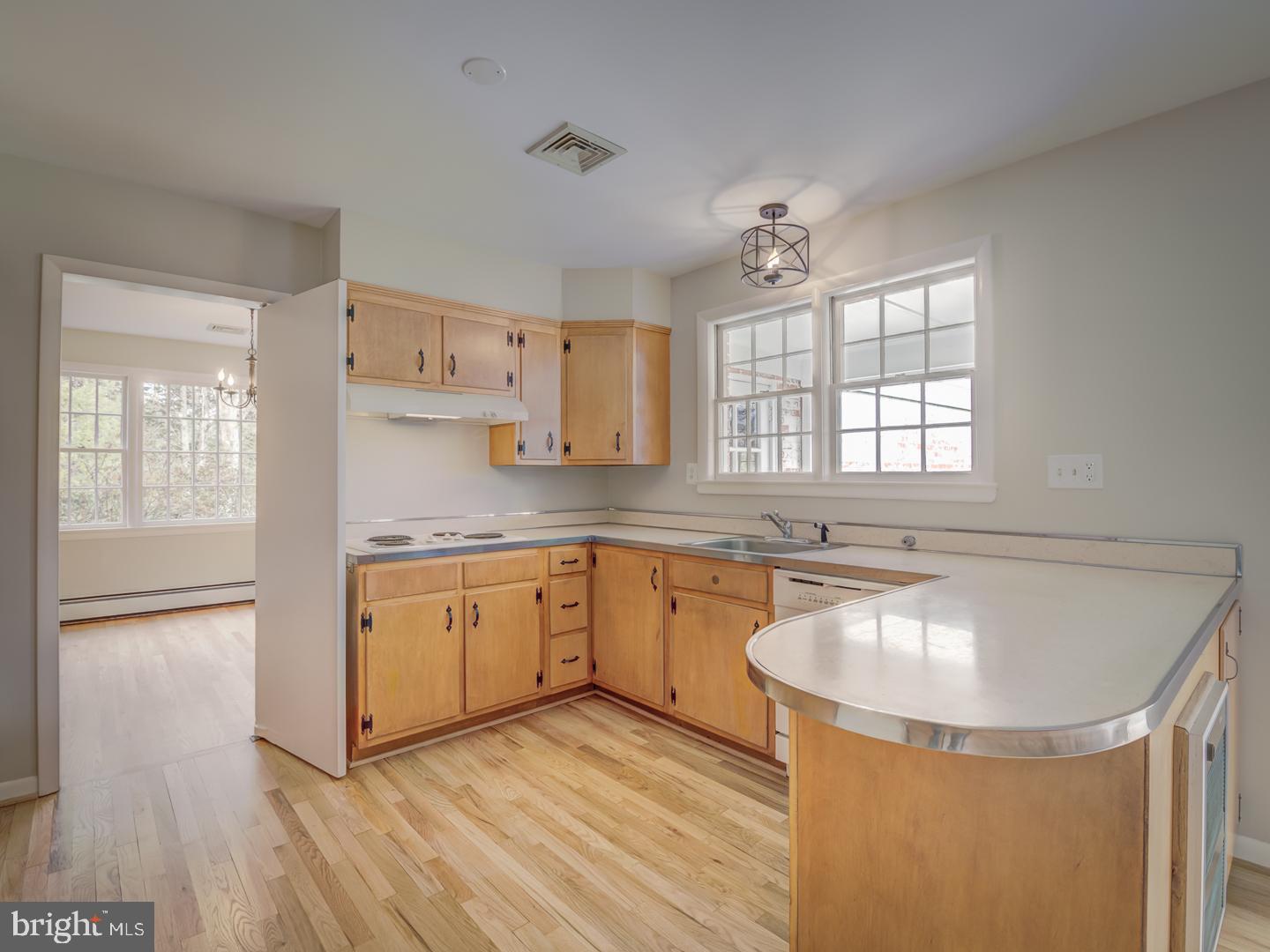 1928 Merrifields Drive Silver Spring, MD 20906 - Photo 18 of 46 Kitchen with swinging door to dining room