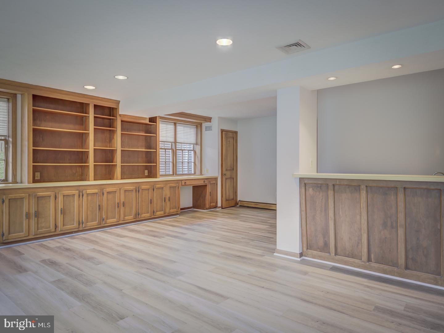 1928 Merrifields Drive Silver Spring, MD 20906 - Photo 33 of 46 Recreation room with built in shelving and wet bar