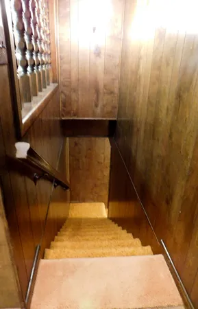 a bathroom with a sink and wooden floor