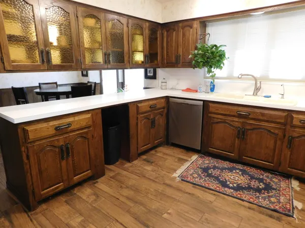 a kitchen with a sink and cabinets