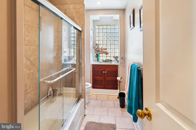 a bathroom with a shower and a tub