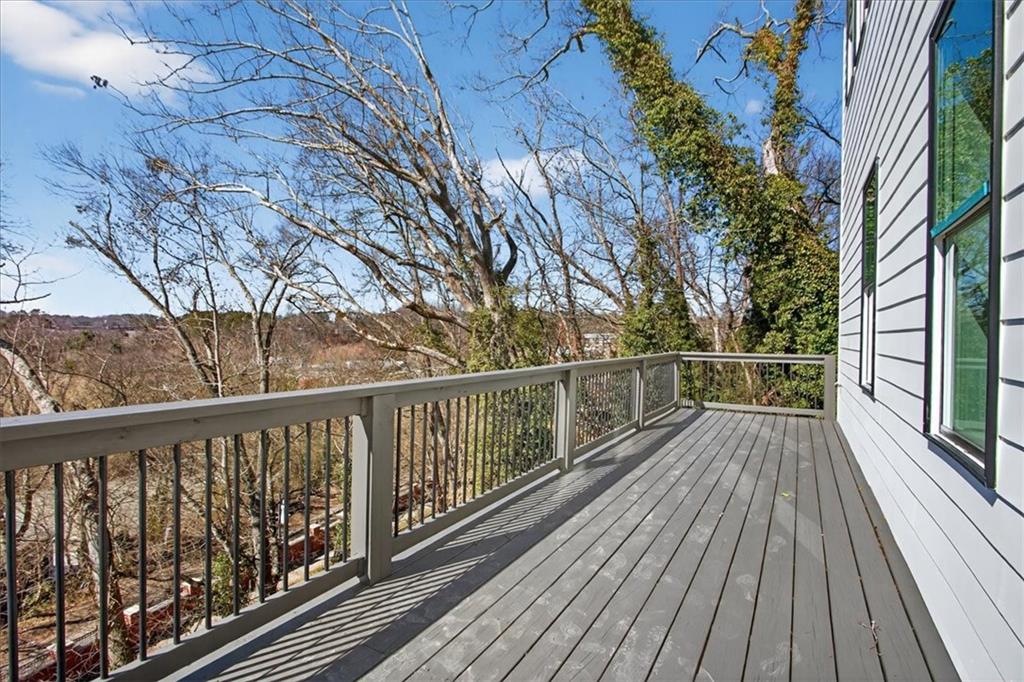 160 Railroad Street Canton, GA 30114 - Photo 11 of 35 a view of balcony with wooden floor and fence