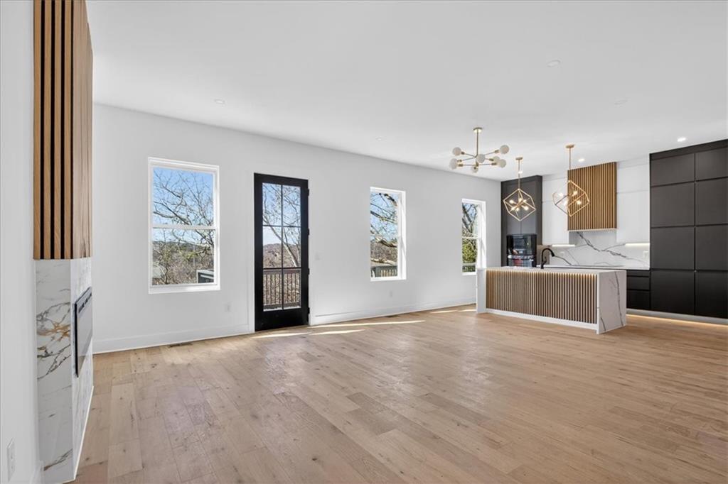 160 Railroad Street Canton, GA 30114 - Photo 12 of 35 a view of an empty room with a kitchen