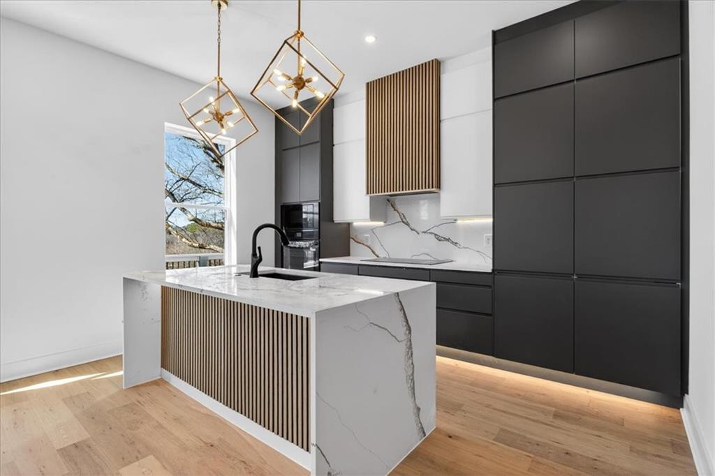 160 Railroad Street Canton, GA 30114 - Photo 13 of 35 a kitchen with a sink and a refrigerator