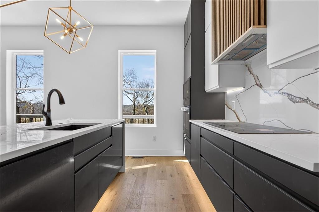 160 Railroad Street Canton, GA 30114 - Photo 14 of 35 a kitchen with a sink and cabinets