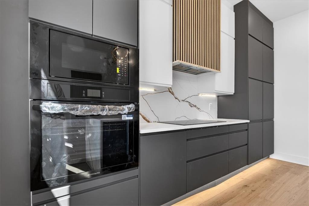 160 Railroad Street Canton, GA 30114 - Photo 15 of 35 a kitchen with a stove and a microwave
