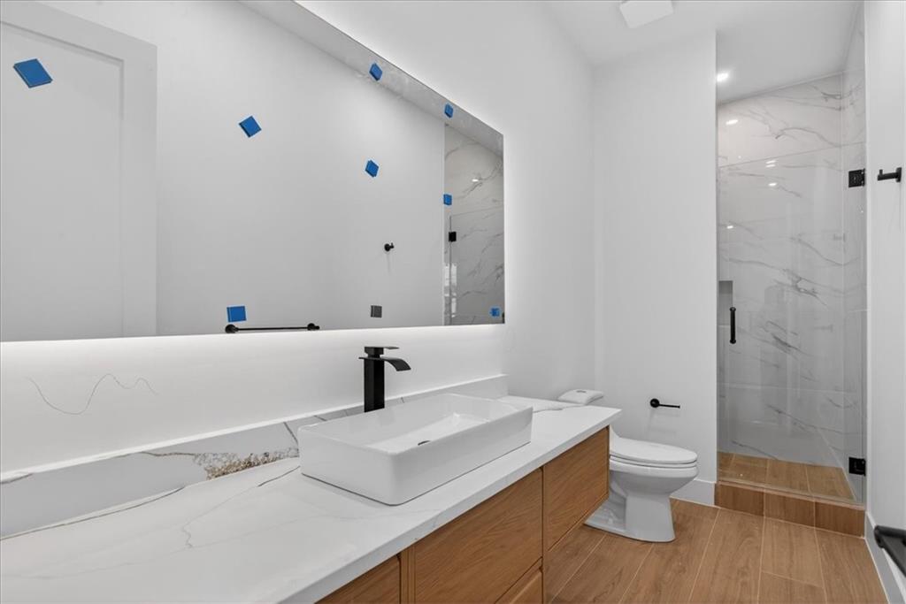 160 Railroad Street Canton, GA 30114 - Photo 17 of 35 a bathroom with a sink toilet and shower