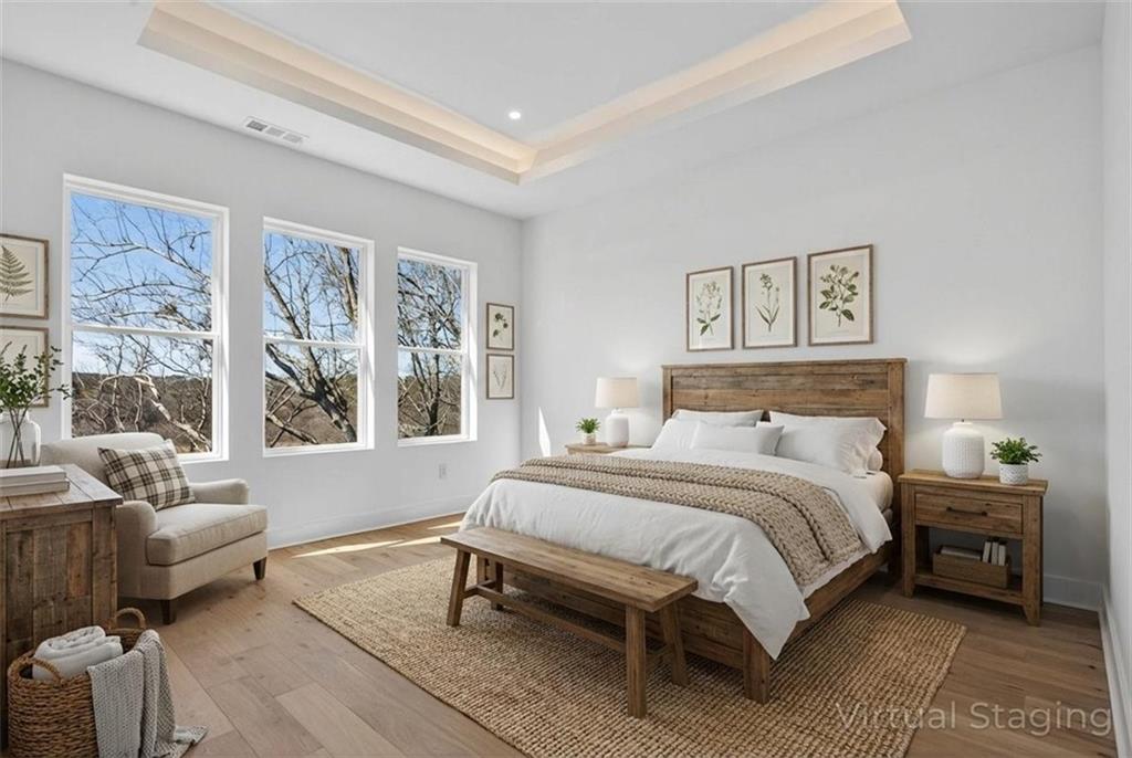 160 Railroad Street Canton, GA 30114 - Photo 19 of 35 a bedroom with a bed and wooden floor