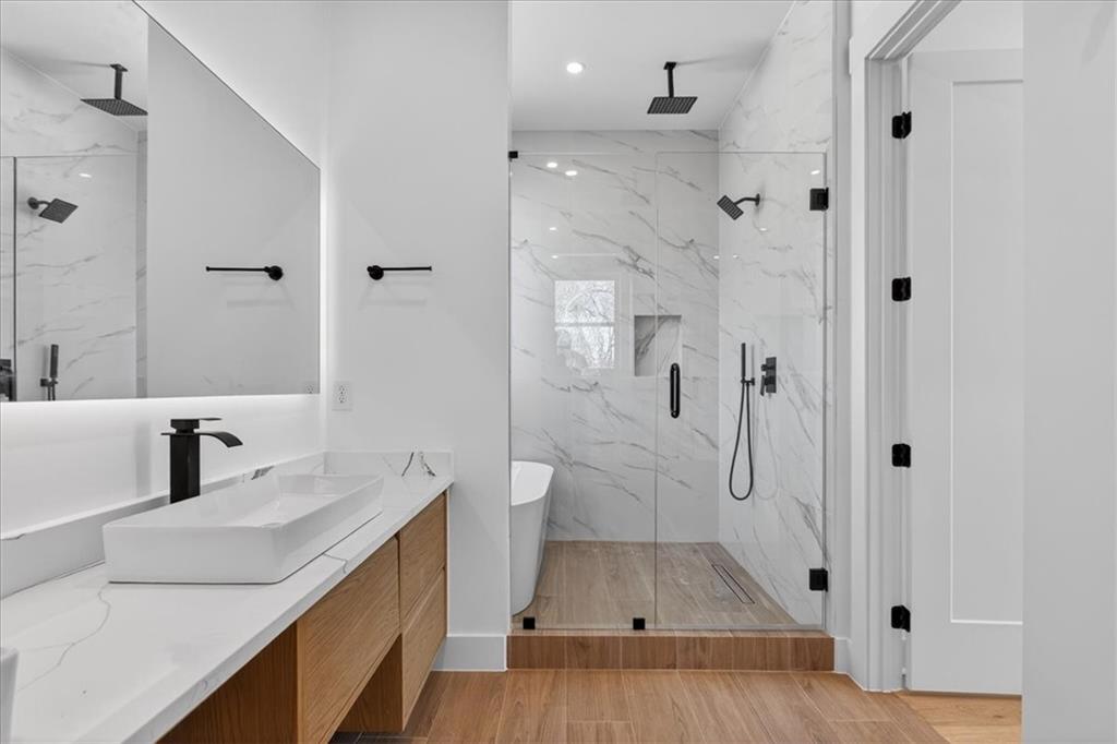 160 Railroad Street Canton, GA 30114 - Photo 24 of 35 a bathroom with a sink a toilet and shower