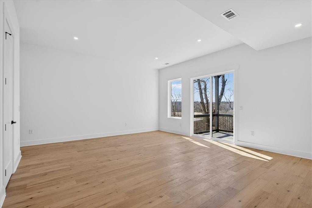 160 Railroad Street Canton, GA 30114 - Photo 28 of 35 wooden floor in an empty room with a window