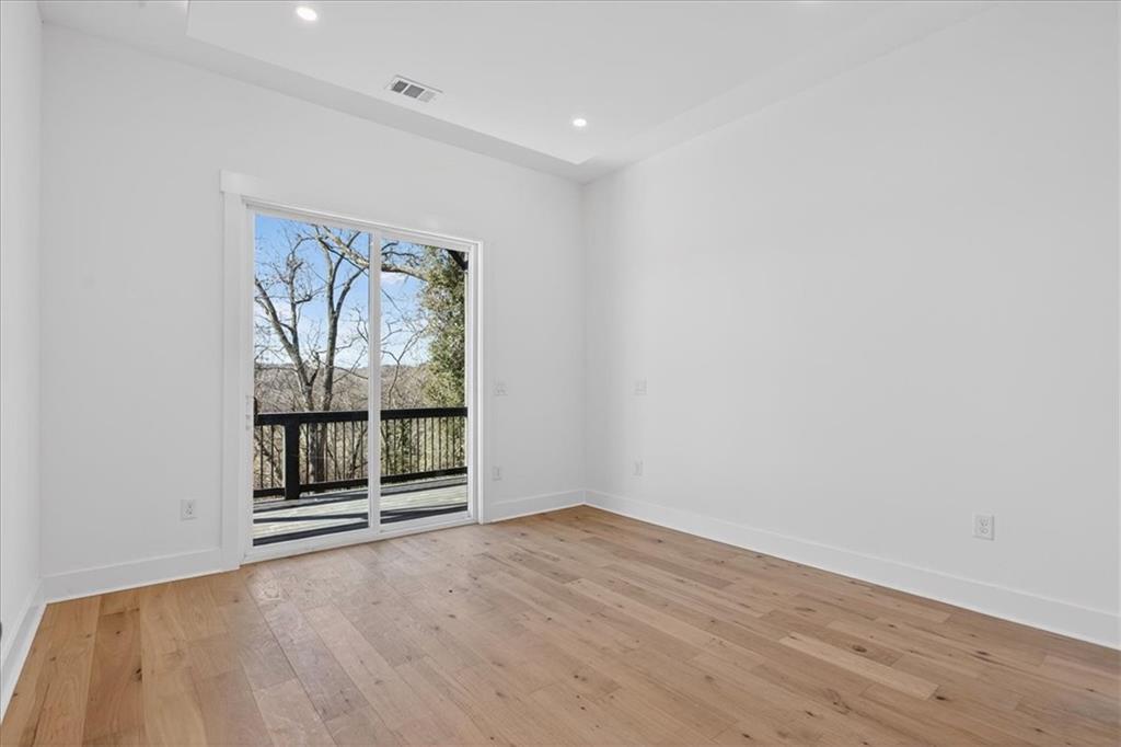 160 Railroad Street Canton, GA 30114 - Photo 30 of 35 an empty room with wooden floor and windows