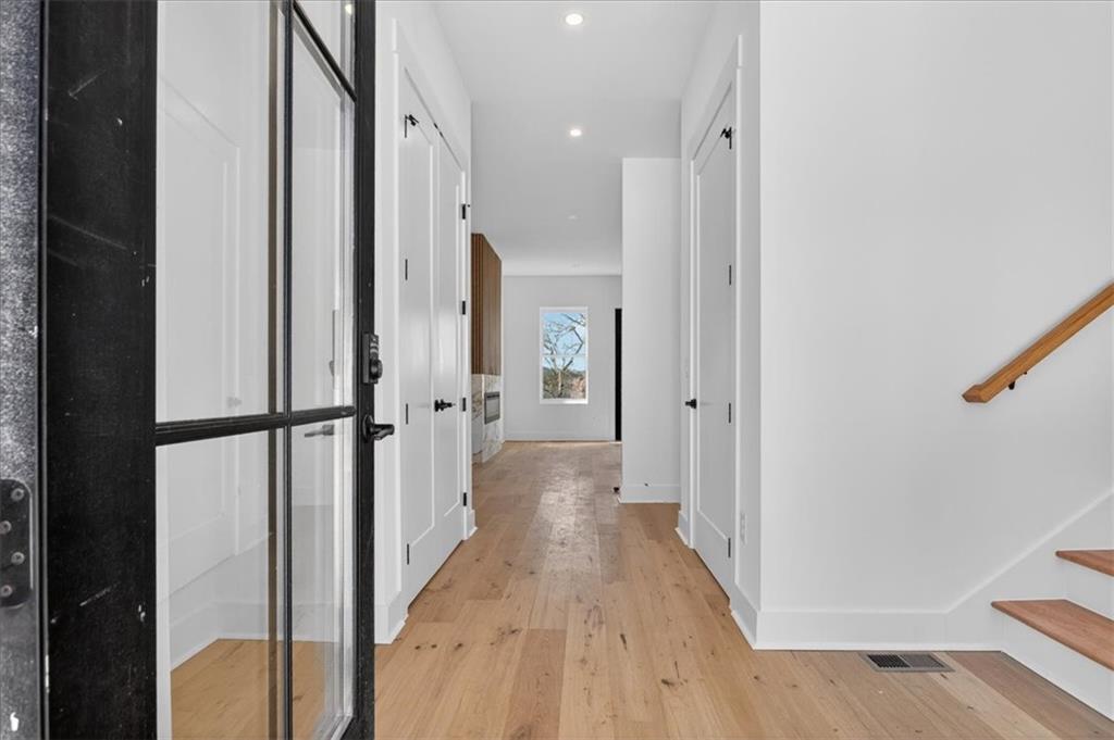 160 Railroad Street Canton, GA 30114 - Photo 6 of 35 a view of a hallway with wooden floor and staircase