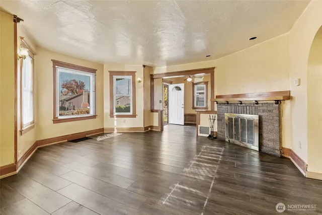 a view of an entryway with wooden floor